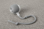 Interactive cat toy ball in gray with elastic mesh tail